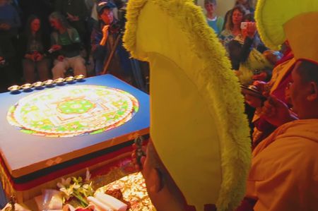 <p>Tibetan Monks prepare to dissove their mandala</p>