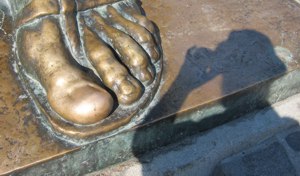 <p>Michael and the much-admired brass toe of Archbishop Nin</p>