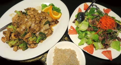 <p>Pad See Iew (Noodles with Vegetables and Chicken) and Yum Neua (Salad with Beef)</p>